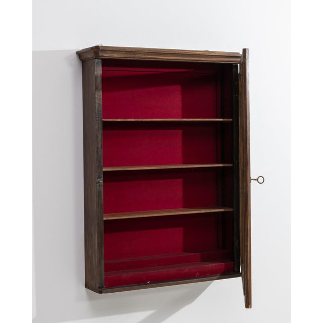 A distinguished example of nineteenth-century French cabinetmaking, this wall-mounted vitrine commands attention with the...
