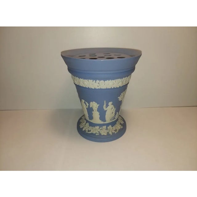A beautiful example of Wedgwood’s timeless craftsmanship, this classic blue Jasperware vase comes complete with its...