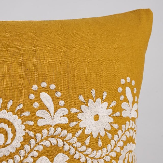 This pillow features Theodora Embroidery with a knife edge finish. Inspired by the folkloric embellishments on an antique...