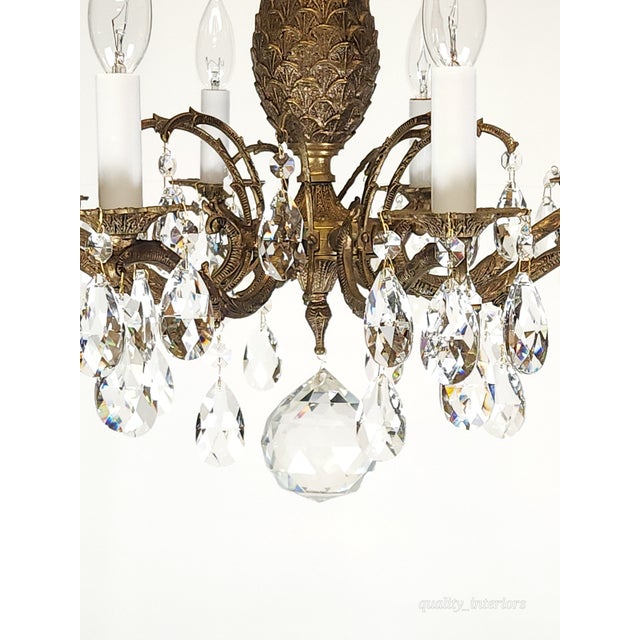 Offered for your consideration is an original Antique 8 Light Petite Shimmering Pineapple Brass Cut Lead Glass Chandelier....