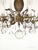 Offered for your consideration is an original Antique 8 Light Petite Shimmering Pineapple Brass Cut Lead Glass Chandelier....