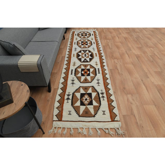 Vintage Turkish Hand-Knotted vintage rug is a semi-antique vintage area rug.'70s Eastern region of Turkey's unique rug is...