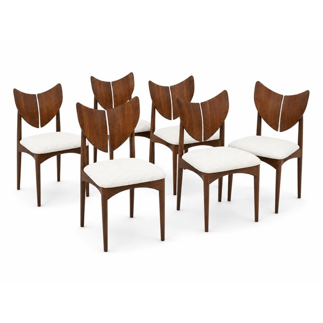 The chairs are solid walnut. The chairs are done in a white Boucle fabric. The style is quite unique and well made. The...