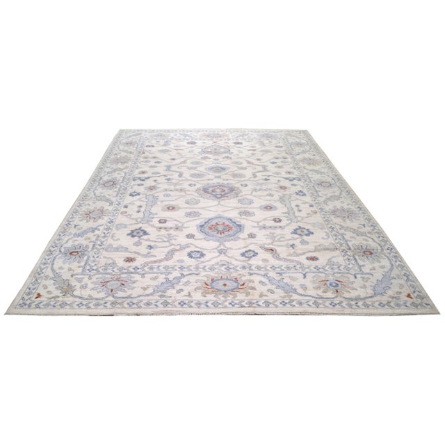 Hand-knotted with care using traditional rug making techniques, this wool rug blends timeless craftsmanship with a modern...