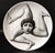 "Sicilian Surrealism": Fornasetti "Tema e Variazioni" Trinacria Plate, (Face with Three Legs), 1990's A striking and...
