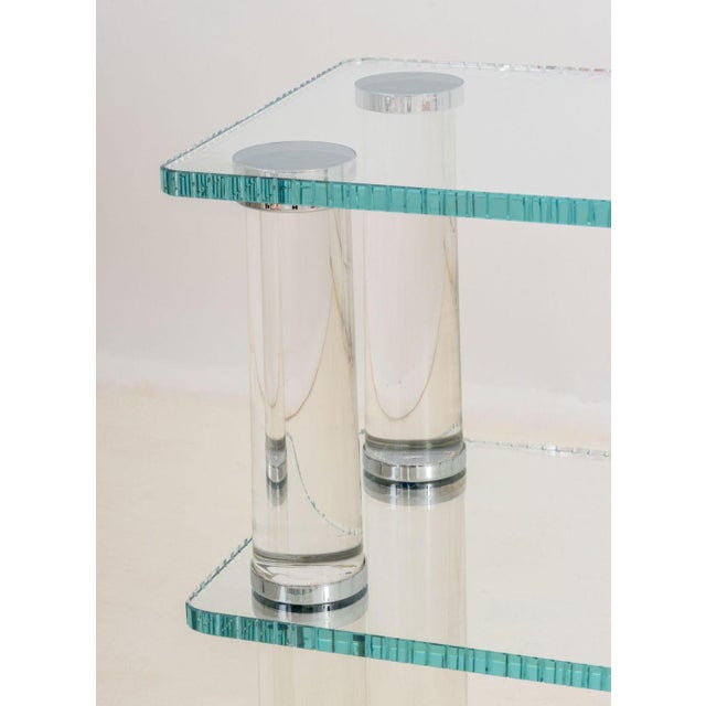 Modern Lucite and Glass Two-Tier Etagere, with two fluted glass shelves. 25.75" H x 67.75" W x 15.75" D. Provenance: From...