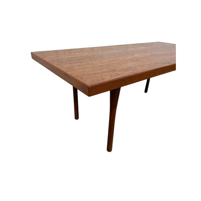 Bring timeless Scandinavian style into your home with this authentic 1960s Danish Modern teak coffee table by Vejen....