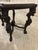 An American Rococo Revival parlor table featuring a rectangular white marble top and ornately carved walnut legs with...