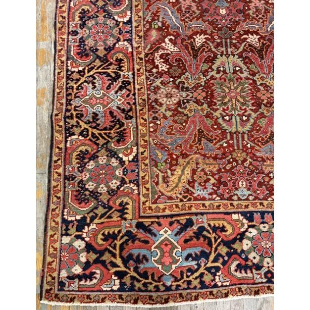 This is a magnificent and highly authentic room-sized antique Heriz rug, dating back to circa 1890. Measuring 9'5" x...