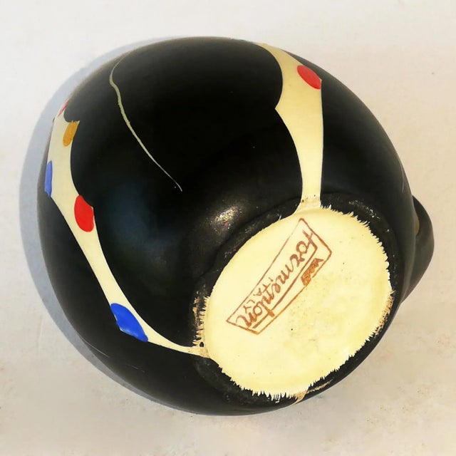 This carafe features abstract designs on a black background.