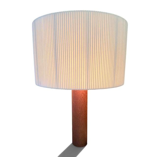 Sapeli Moragas table lamp for Santa & Cole designed by Antoni De Moragas Gallissà. With a solid wood cylindrical base and...
