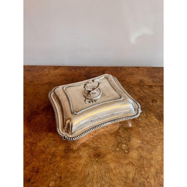 Antique Edwardian silver plated entree dish having a quality antique Edwardian silver plated entree dish, rectangular in...