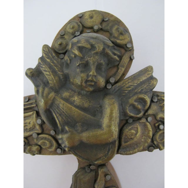 Unique Mexican folk art Milagros cross featuring a central guardian angel. Thick hand carved wood showing rounded edges...
