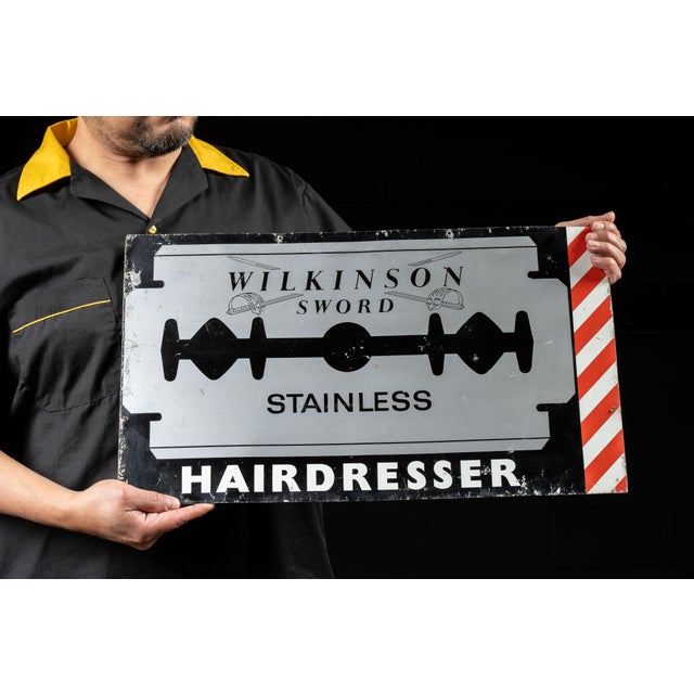 c. 1930-1950s; Wilkinson Sword, Ltd. - London Vintage tin litho hairdresser advertising sign. This piece advertises...