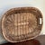 Offering a lovely Rustic European-style wicker tray with build-in handles. This pretty vintage piece from the early- to...