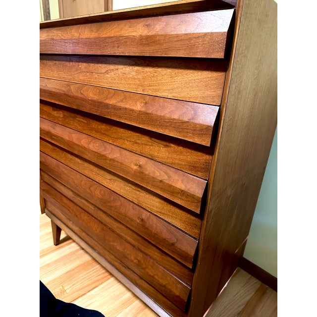 This exquisite walnut Mid-Century Modern sculptural 5-drawer highboy dresser showcases stunning craftsmanship and features...