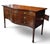 An exceptional and highly sophisticated English George III Hepplewhite serpentine sideboard, handcrafted circa 1790–1805...