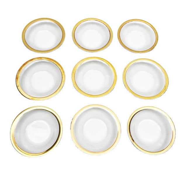 We were so thrilled to find a large 9 piece set of these! They are high quality, Italian hand blown glass bowls that...