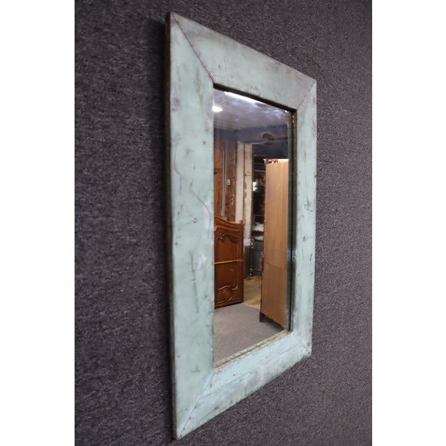 Reclaimed copper-clad wall mirror sourced from Olde Good Things in New York City. The handcrafted frame is wrapped in aged...