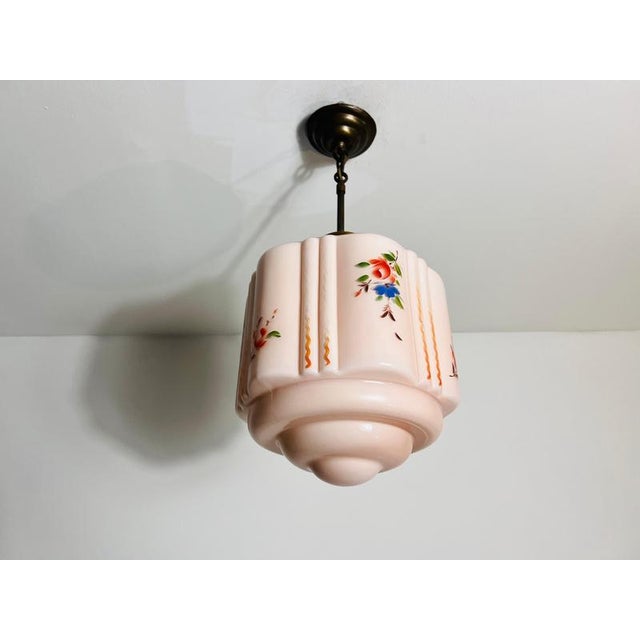 This exquisite ceiling lamp from 1930s germany exudes timeless elegance and charm. The lampshade is crafted from genuine...