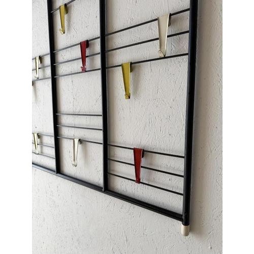Dutch Ladder wall coat rack, designed by Tjerk Reijenga for Pilastro in the 1950s. The design consists of a large black...