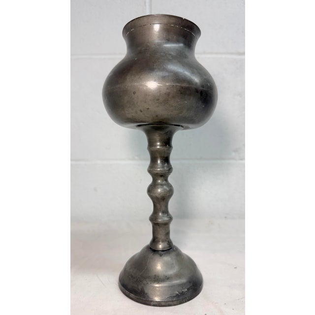 This rare antique 17th century English Renaissance turned pewter chalice is a unique and collectible piece of metalware....