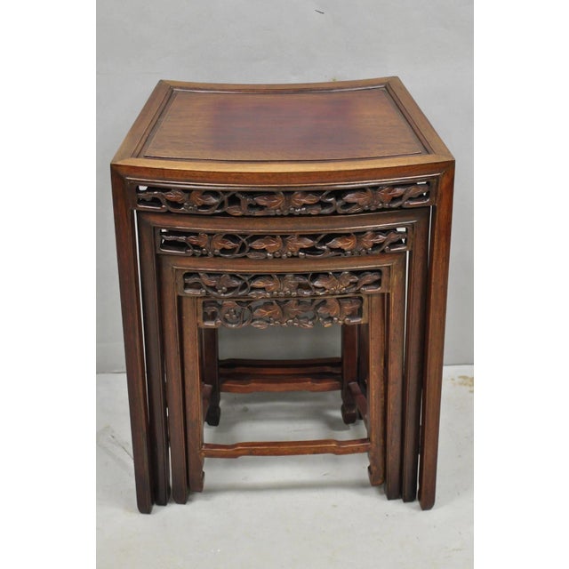 Vintage Chinese Carved Hardwood Curved Frame Oriental Nesting Side Tables with Leaf Carved Skirts- Set of 4. Circa Mid...