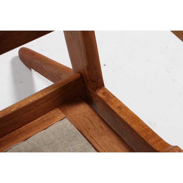 Hans J. Wegner three-seat sofa made of solid oil treated oak. New upholstered with boucle. Model 290, made by GETAMA. This...