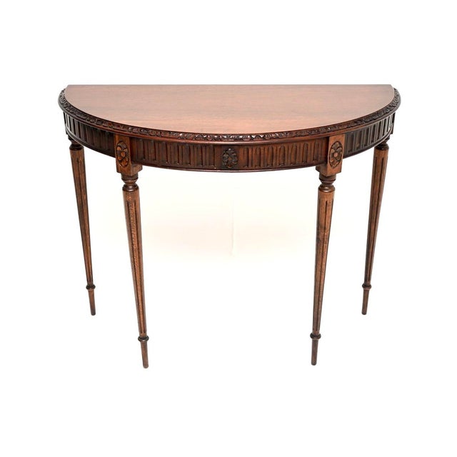 A beautiful and elegant antique console table. This was made in England, it dates from around the 1900-1920 period. The...