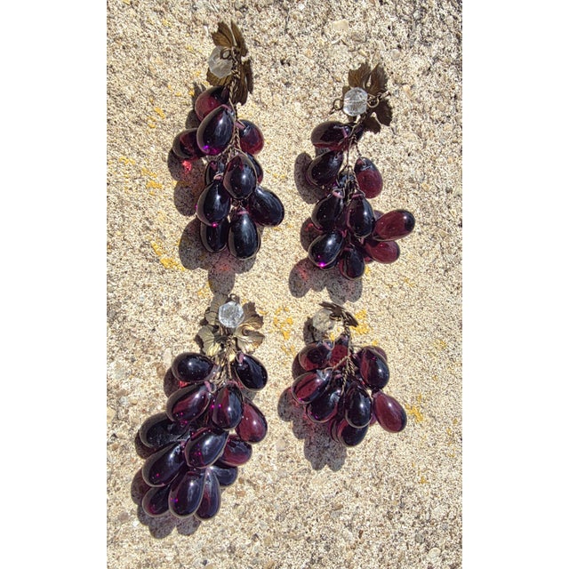 Wonderful antique glass grapes that were taken off an antique chandelier years ago. There is also a brass leaf on each one.