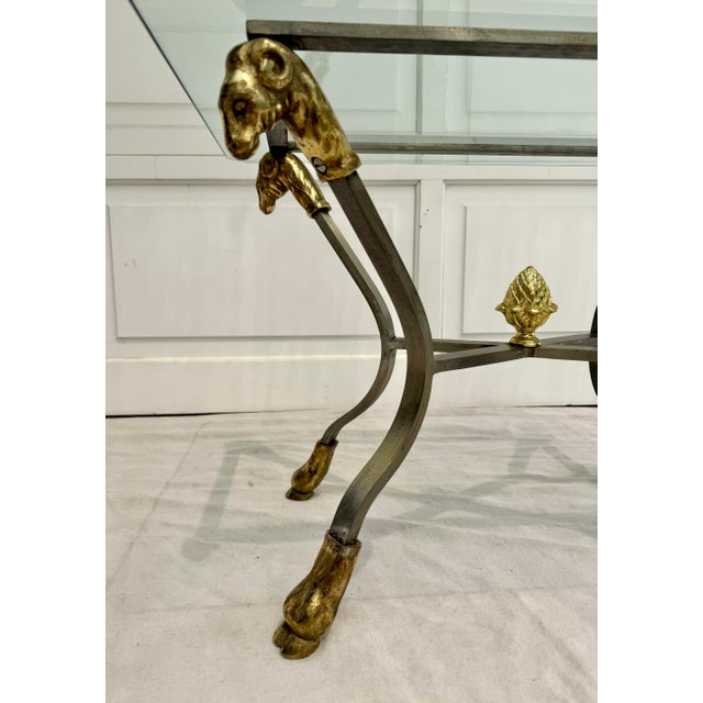 In the style of Maison Jansen and LaBarge, this elegant glass-top side table dates to the mid-20th century and showcases a...