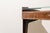 Mid-Century Italian console table from the 1950s, made of wood. It features slender and elegant proportions. The main body...