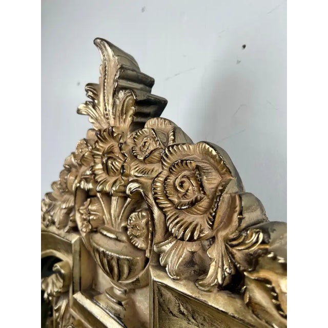 Neoclassical Revival Champagne Gold Large Mirror with Urn and Floral Pediment: This elegant wall mirror by the Bombay...