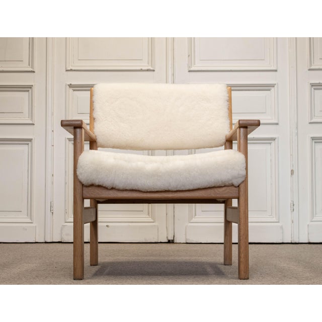 Refined and highly tactile armchair designed by Hans J. Wegner, produced by Getama, Denmark in the 1980s. Crafted from...