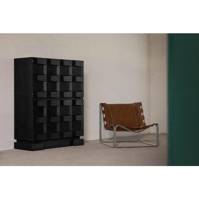 A rare and masterfully crafted example of 1970s Belgian brutalist design, this graphic-paneled bar cabinet by Maison...