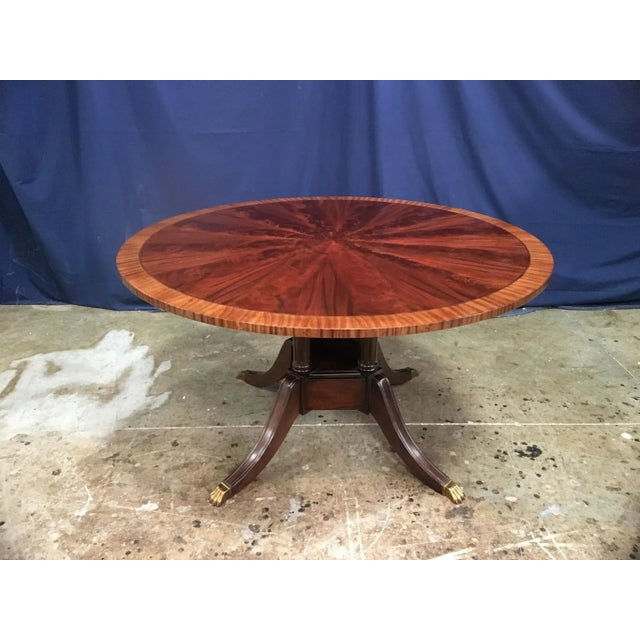 This is made-to-order round traditional mahogany dining table made in the Leighton Hall shop. It features field of radial...