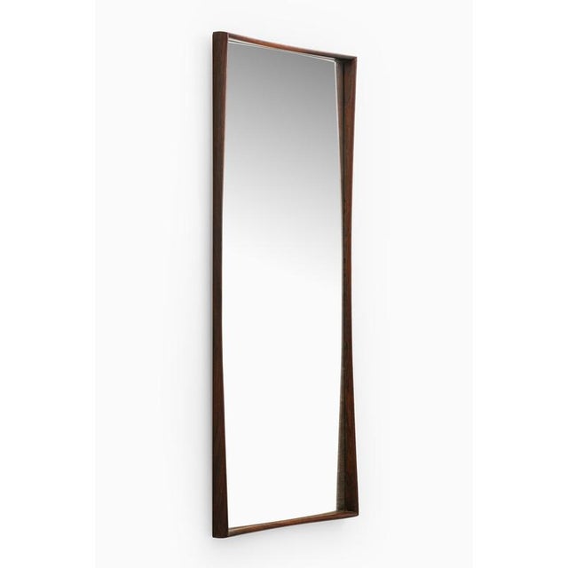 This rare mirror, designed by rimbert sandholt and produced by glas & trä hovmantorp in sweden during the 1950s, is a...