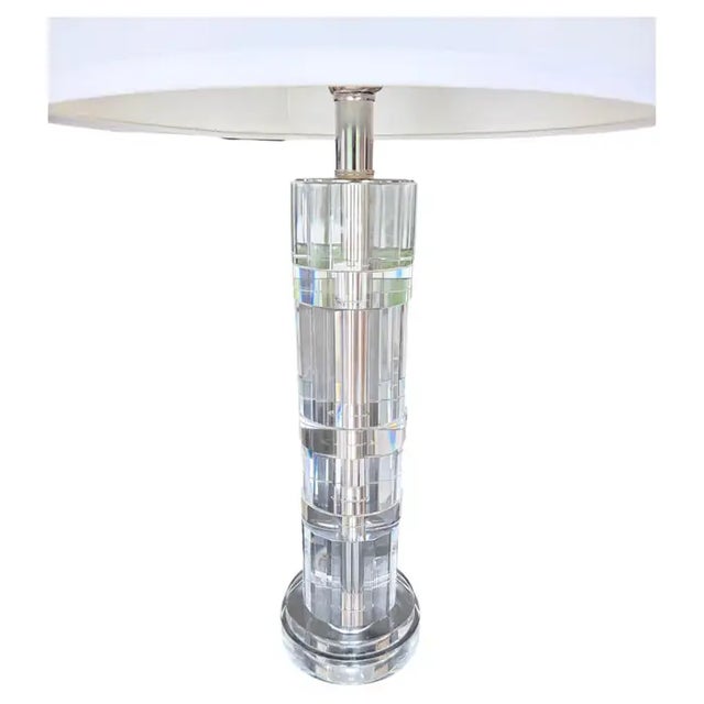 Gorgeous pair of Ralph Lauren crystal and chrome table lamps. These spectacular lamps feature solid faceted cut crystal...