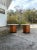 Classy little pair of Twin Italian Round Travertine Top Side tables. Absolutely stunning hexagon wood bases contrast the...