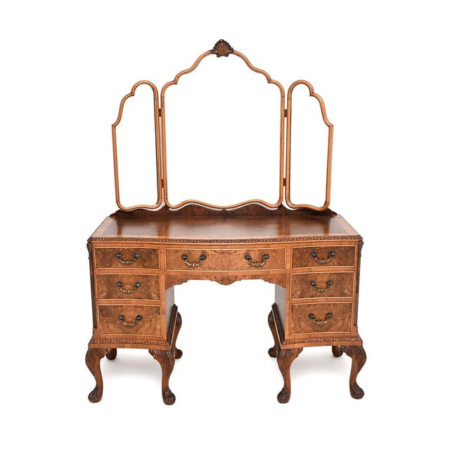 A stunning antique burr walnut dressing table in the Queen Anne style. This was made in England, it dates from around the...