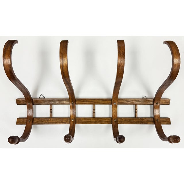 Vintage four prong bentwood wall rack. Ideal for hanging hats and coat in an entry, hall, or bedroom. Nice turned wood...