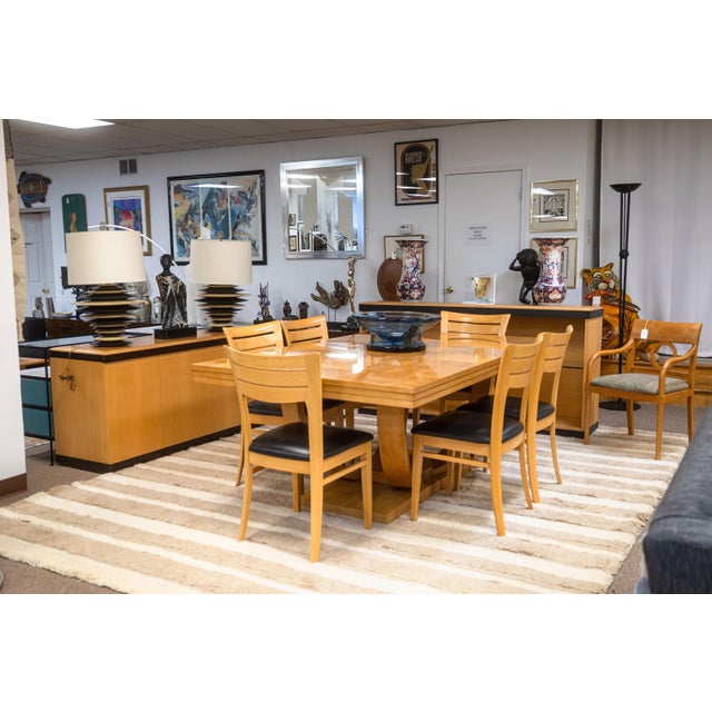 A vintage postmodern burlwood credenza. This wonderful cabinet features a simple modern design, with a blonde wood...