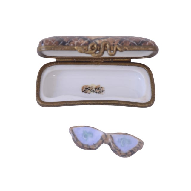 Hand painted Limoges of France domed trinket box designed as a chic snake skin eye glasses case in 24 kt gold, brown,...