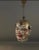 A hand-blown, silvered glass clown-head ornament from 1920s Germany, notable for its larger size and expressive molded...