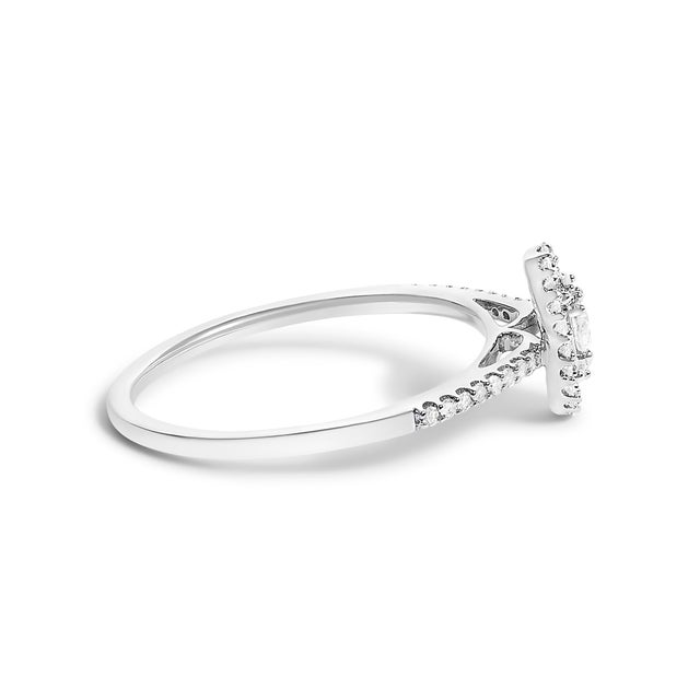 A masterpiece of delicate craftsmanship, this engagement ring is wrought from lustrous 14K white gold, finished with a...