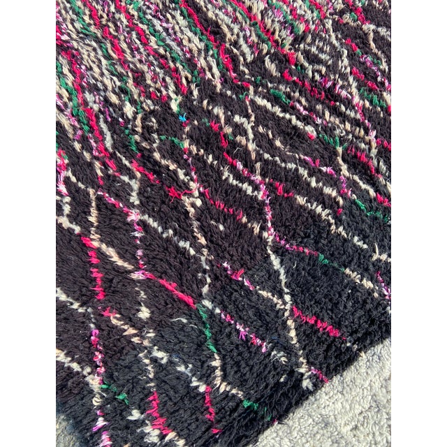 Hand-woven by the Berber women in the Atlas Mountains, this Vintage rug is created with soft natural wool fibers from the...