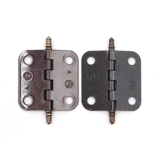 Vintage cabinet hinges made brass plated steel with brass tips. They feature steeple finials, six knuckles, and a template...