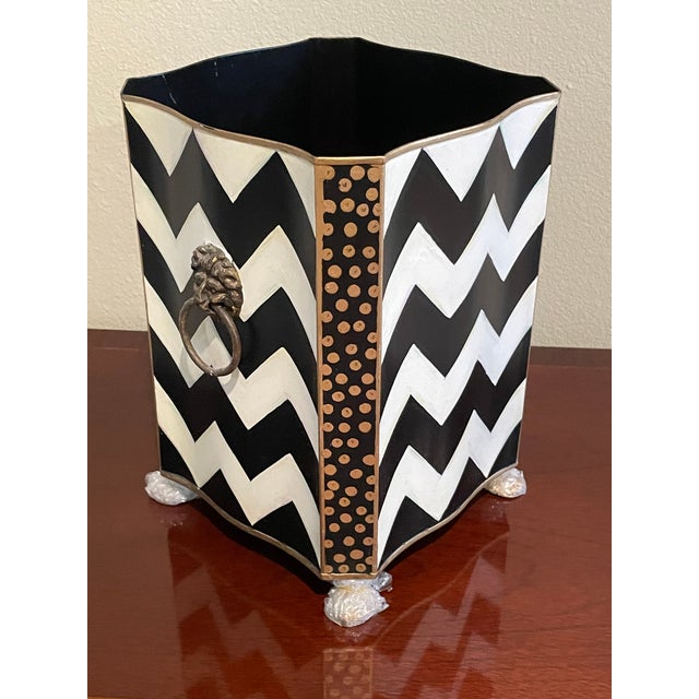 The whimsical design for which Mackenzie Childs is known is evident in this unique wastebasket in the zigzag pattern. In...