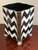 The whimsical design for which Mackenzie Childs is known is evident in this unique wastebasket in the zigzag pattern. In...