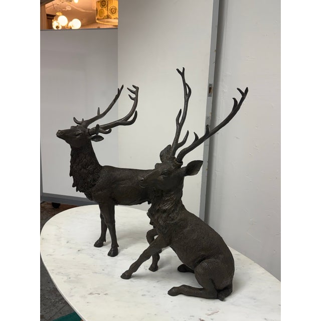 Design Plus Gallery presents a Pair of Majestic Antlered Resin Reindeer Sculptures. This decorative duo portrays two...